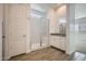 Bathroom showcasing a glass enclosed shower, vanity with granite top, and tile floors at 16765 W Bronco Trl, Surprise, AZ 85387