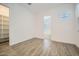 Bright bedroom features tile floors, natural light, and a walk-in closet at 16765 W Bronco Trl, Surprise, AZ 85387