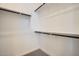 Walk-in closet provides ample storage with shelving and hanging rods at 16765 W Bronco Trl, Surprise, AZ 85387