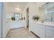 Bright bathroom featuring double sinks, ample counter space, and stylish fixtures at 16781 W Bronco Trl, Surprise, AZ 85387