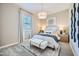 Cozy bedroom featuring a plush bed, stylish lighting, neutral tones, and a decorative rug creating a serene space at 16781 W Bronco Trl, Surprise, AZ 85387