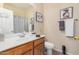 Bright bathroom featuring a vanity with white countertop and a mirror at 17704 W Tasha Dr, Surprise, AZ 85388