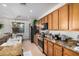 Stylish kitchen featuring granite countertops, stainless steel appliances, and wooden cabinetry at 17704 W Tasha Dr, Surprise, AZ 85388