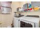 A functional laundry room with modern washer and dryer at 17704 W Tasha Dr, Surprise, AZ 85388