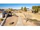 Scenic aerial view of a walking path winding through a well-maintained park-like setting in a quiet neighborhood at 17704 W Tasha Dr, Surprise, AZ 85388