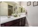 Bathroom featuring double sinks, framed mirrors, and white countertop at 19057 W Yucatan Dr, Surprise, AZ 85388