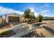 Charming home featuring a well-maintained front yard and a spacious driveway leading to an attached garage at 19057 W Yucatan Dr, Surprise, AZ 85388