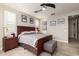 Main bedroom featuring natural light, ceiling fan and wood look flooring at 19057 W Yucatan Dr, Surprise, AZ 85388