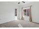 Bedroom featuring carpet, two windows, and light neutral walls at 1920 E Bell Rd # 1153, Phoenix, AZ 85022