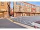 Exterior view of townhomes with private garages and well-maintained landscaping at 1920 E Bell Rd # 1153, Phoenix, AZ 85022