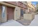 Exterior of a two-story townhome featuring a private front entrance and manicured landscaping at 1920 E Bell Rd # 1153, Phoenix, AZ 85022