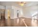 Bedroom featuring hardwood floors, closet space, and two doorways at 2091 E Flintlock Way, Chandler, AZ 85286