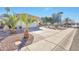 View of the front exterior with desert landscaping along the driveway at 2091 E Flintlock Way, Chandler, AZ 85286