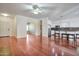 Hardwood floors, fireplace and an island with seating create an inviting living space at 2091 E Flintlock Way, Chandler, AZ 85286