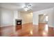 Spacious living room with a decorative tile fireplace and hardwood floors at 2091 E Flintlock Way, Chandler, AZ 85286