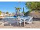 Inviting pool area with a dining table and chairs, perfect for outdoor entertaining at 2091 E Flintlock Way, Chandler, AZ 85286