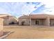 View of the backyard area featuring a patio, lawn, and neutral-toned exterior walls at 2101 S Yellow Wood -- # 22, Mesa, AZ 85209