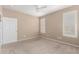 Neutral bedroom with light carpet and white trimmed windows at 2101 S Yellow Wood -- # 22, Mesa, AZ 85209