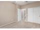 Bedroom with standard closet doors, connecting door, and carpeted floor at 2101 S Yellow Wood -- # 22, Mesa, AZ 85209