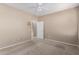 Neutral bedroom with light carpet, ceiling fan, and a white door to the rest of the house at 2101 S Yellow Wood -- # 22, Mesa, AZ 85209