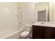 Clean bathroom featuring a shower-tub combo and a dark-stained vanity at 2379 E San Miguel Dr, Casa Grande, AZ 85194