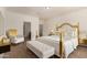 Staged modern bedroom with neutral paint, wood-look floors, and doorway to the en suite bathroom at 2379 E San Miguel Dr, Casa Grande, AZ 85194