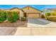 Inviting single-story home with well-maintained landscaping and a cozy facade at 2379 E San Miguel Dr, Casa Grande, AZ 85194