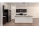 Modern kitchen featuring stainless steel appliances and a kitchen island at 2379 E San Miguel Dr, Casa Grande, AZ 85194