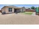 Spacious backyard with gravel, a small grass patch, and a patio area perfect for outdoor entertaining at 26020 N 138Th Ln, Peoria, AZ 85383