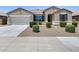 Charming single-story home featuring a neutral color scheme, well-manicured landscaping and a two-car garage at 26020 N 138Th Ln, Peoria, AZ 85383