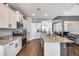 Spacious kitchen boasting stainless steel appliances, a large island, and white cabinets at 26020 N 138Th Ln, Peoria, AZ 85383