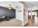 Cozy living room with plush carpet and views of the backyard from the sliding doors. Includes a ceiling fan at 26020 N 138Th Ln, Peoria, AZ 85383