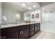 Bathroom featuring dual sinks, granite counters, framed mirror and glass shower at 26509 W Ponderosa Ln, Buckeye, AZ 85396