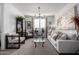 Inviting living room with a neutral palette, comfortable seating, and stylish decor at 26509 W Ponderosa Ln, Buckeye, AZ 85396