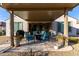 Covered patio with comfortable seating area, perfect for outdoor entertaining at 26509 W Ponderosa Ln, Buckeye, AZ 85396