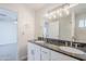 Bathroom features a double vanity, granite countertop, modern lighting, and tiled shower at 2728 W Redfield Rd, Phoenix, AZ 85053