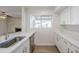 Bright kitchen featuring stainless steel appliances, updated countertops, and white cabinets at 2728 W Redfield Rd, Phoenix, AZ 85053