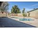 Backyard features a refreshing private pool, block fence and mature desert landscaping at 2728 W Redfield Rd, Phoenix, AZ 85053