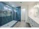 Bathroom featuring stylish blue tile shower with glass enclosure, and white vanity at 2749 E Wier Ave, Phoenix, AZ 85040