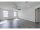 Bedroom with ceiling fan, neutral walls and lots of natural light from dual windows at 2749 E Wier Ave, Phoenix, AZ 85040