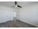 Bedroom with ceiling fan and door open into the hall at 2749 E Wier Ave, Phoenix, AZ 85040