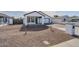 Charming exterior features desert landscaping, a two-car garage and a covered front porch at 2749 E Wier Ave, Phoenix, AZ 85040