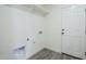 This laundry room features hookups and a door to the outside at 2749 E Wier Ave, Phoenix, AZ 85040