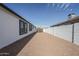 Long side yard is xeriscaped with rock and a white concrete block wall at 2749 E Wier Ave, Phoenix, AZ 85040