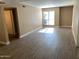 Spacious living room with vinyl plank flooring and natural light from a large window at 3131 W Cochise Dr # 218, Phoenix, AZ 85051