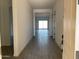 Bright entryway featuring neutral walls and stylish gray wood-look tile flooring at 31512 N Hayweather Ln, San Tan Valley, AZ 85143