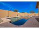 A backyard view of a pool with a storage shed at 3408 W Taro Ln, Phoenix, AZ 85027