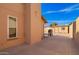 A concrete patio with a shed and a grill at 3408 W Taro Ln, Phoenix, AZ 85027