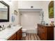 Well-lit bathroom with a shower/tub combo, vanity, tile surround, and wood floors at 3408 W Taro Ln, Phoenix, AZ 85027