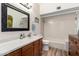 Bathroom with tile surround shower/tub, vanity with a mirror and drawers on the side at 3408 W Taro Ln, Phoenix, AZ 85027